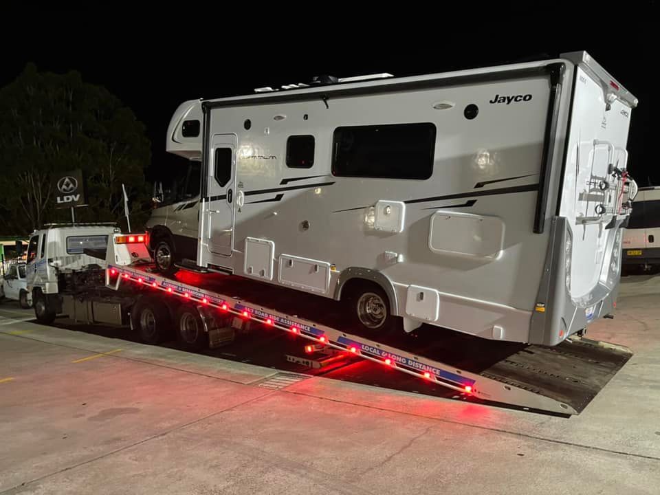 Jayco Motorhome Towing at Night — Trade & General Towing in Hexham, NSW