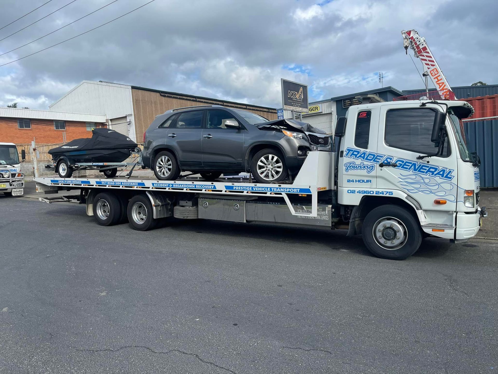 Towing the Kia Sorento and the Jet Ski — Trade & General Towing in Newcastle, NSW