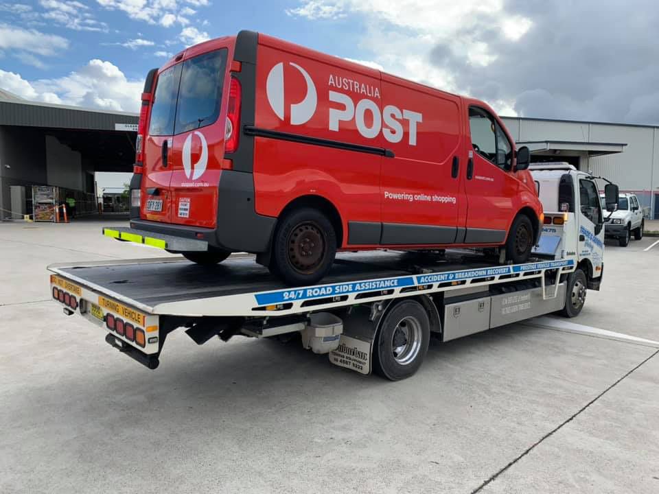Towing the Orange Post Van — Trade & General Towing in Sandgate, NSW