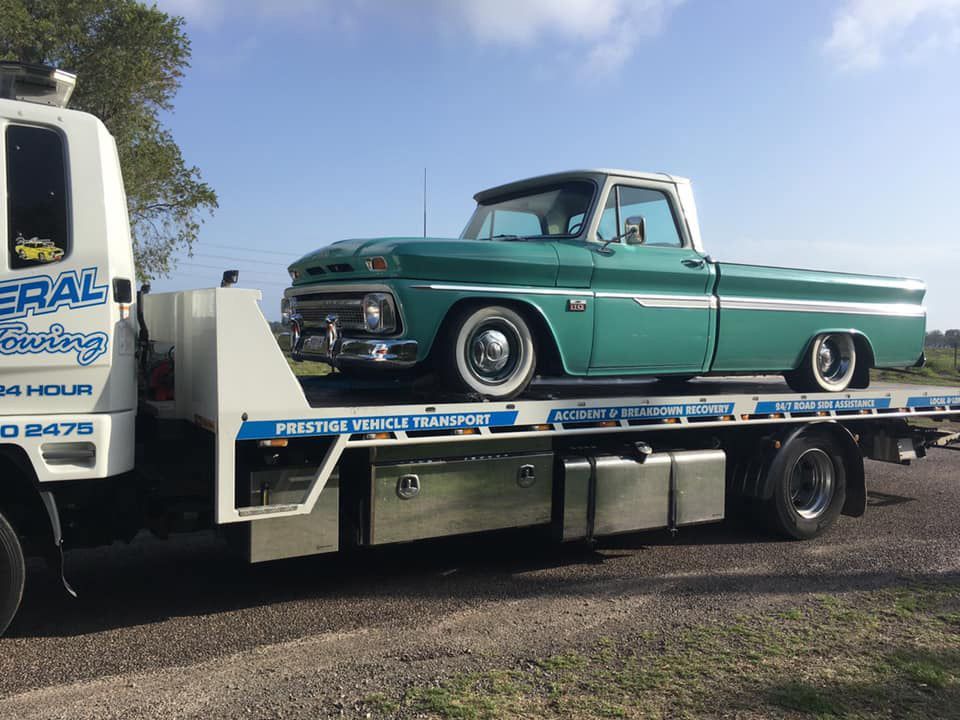 Towing the Vintage Green Pick Up Car — Trade & General Towing in Sandgate, NSW