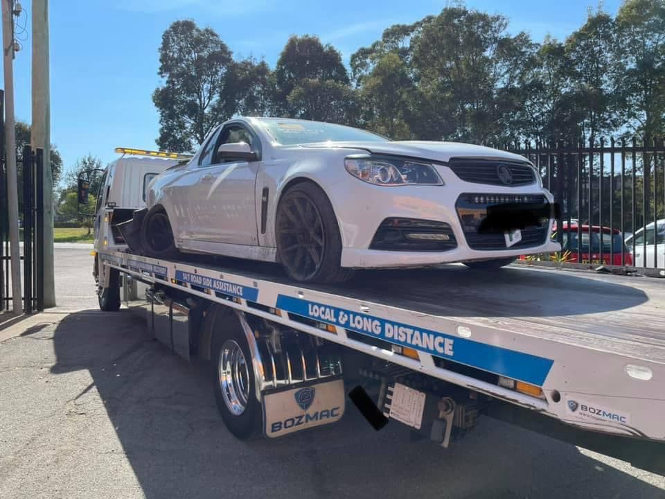 Towing the White Ferrari Car — Trade & General Towing in Sandgate, NSW