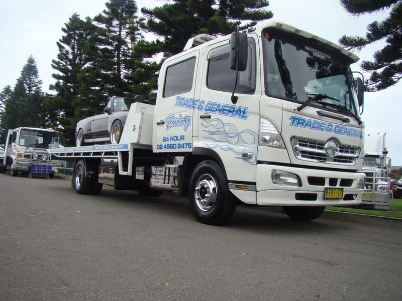 Two White Towing Truck Parked — Trade & General Towing In Sandgate NSW