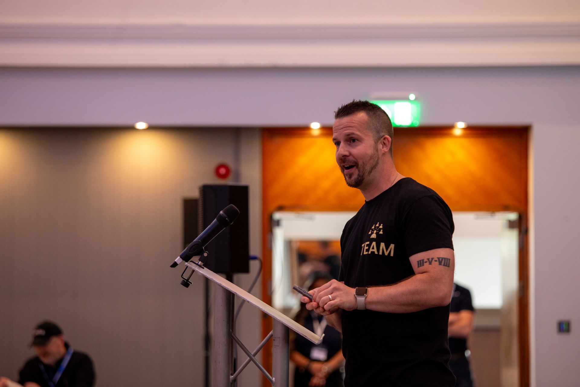 A man is standing at a podium giving a speech.