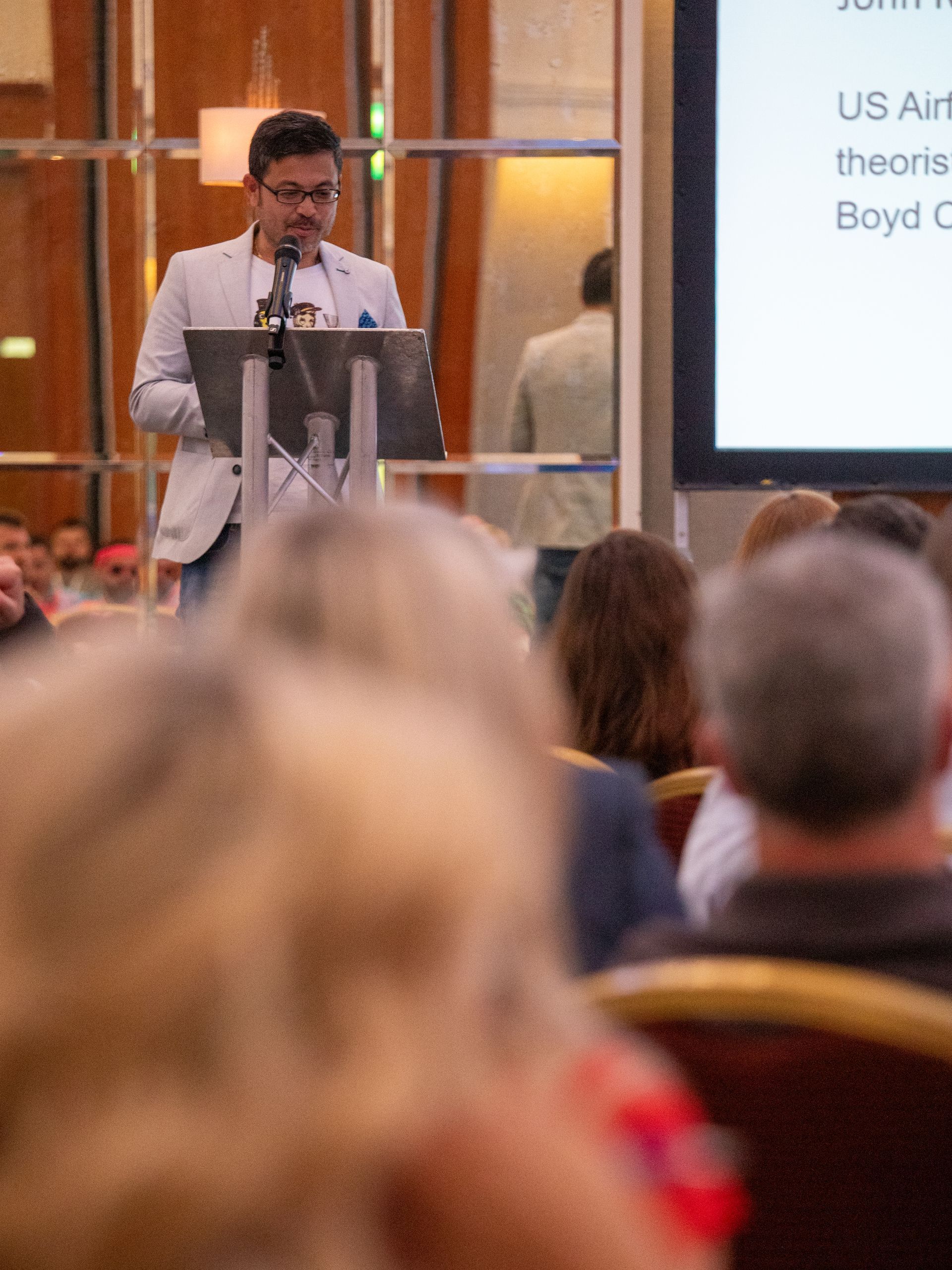 A man is giving a presentation to a group of people
