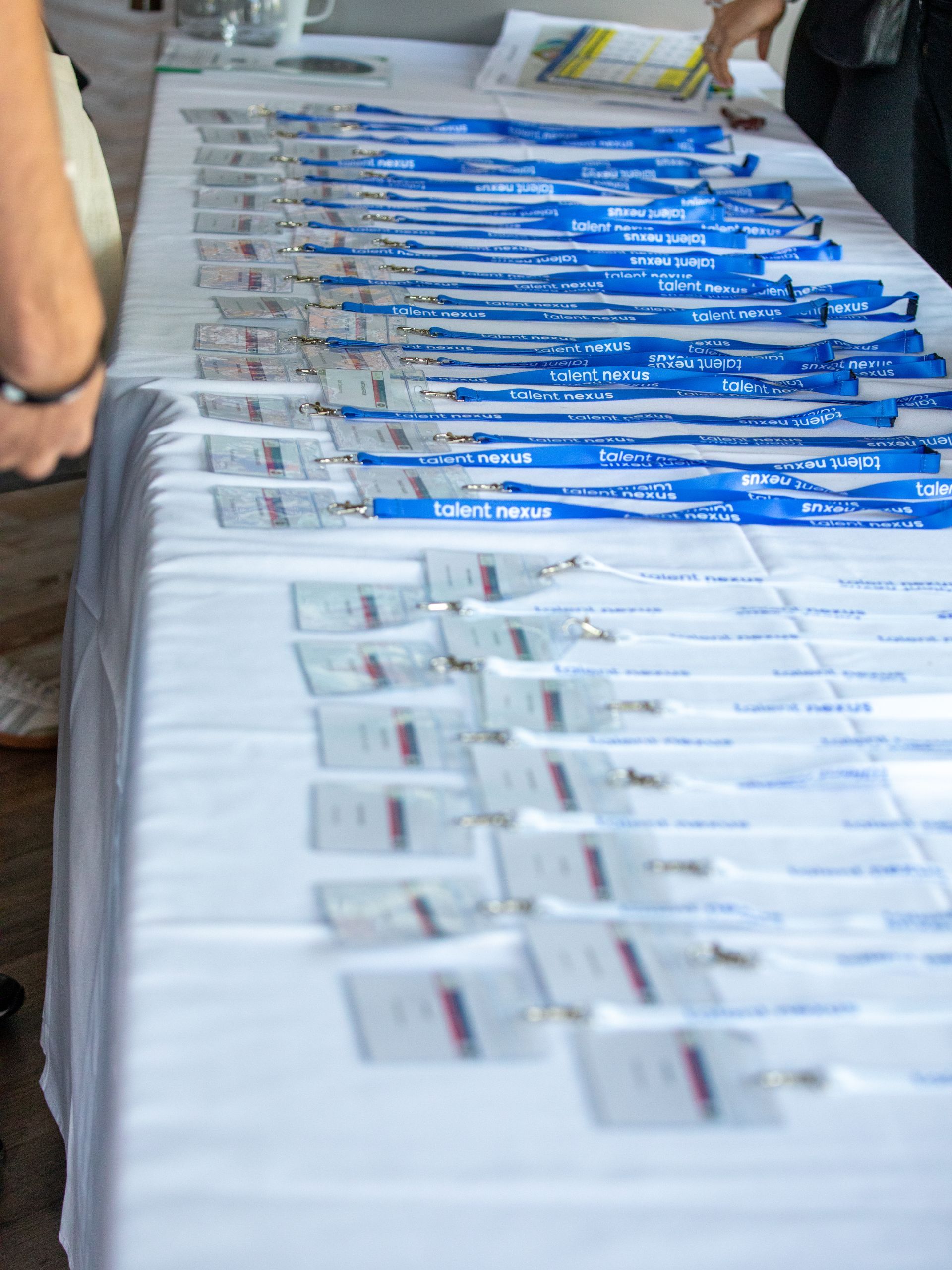 A table with a lot of name tags on it