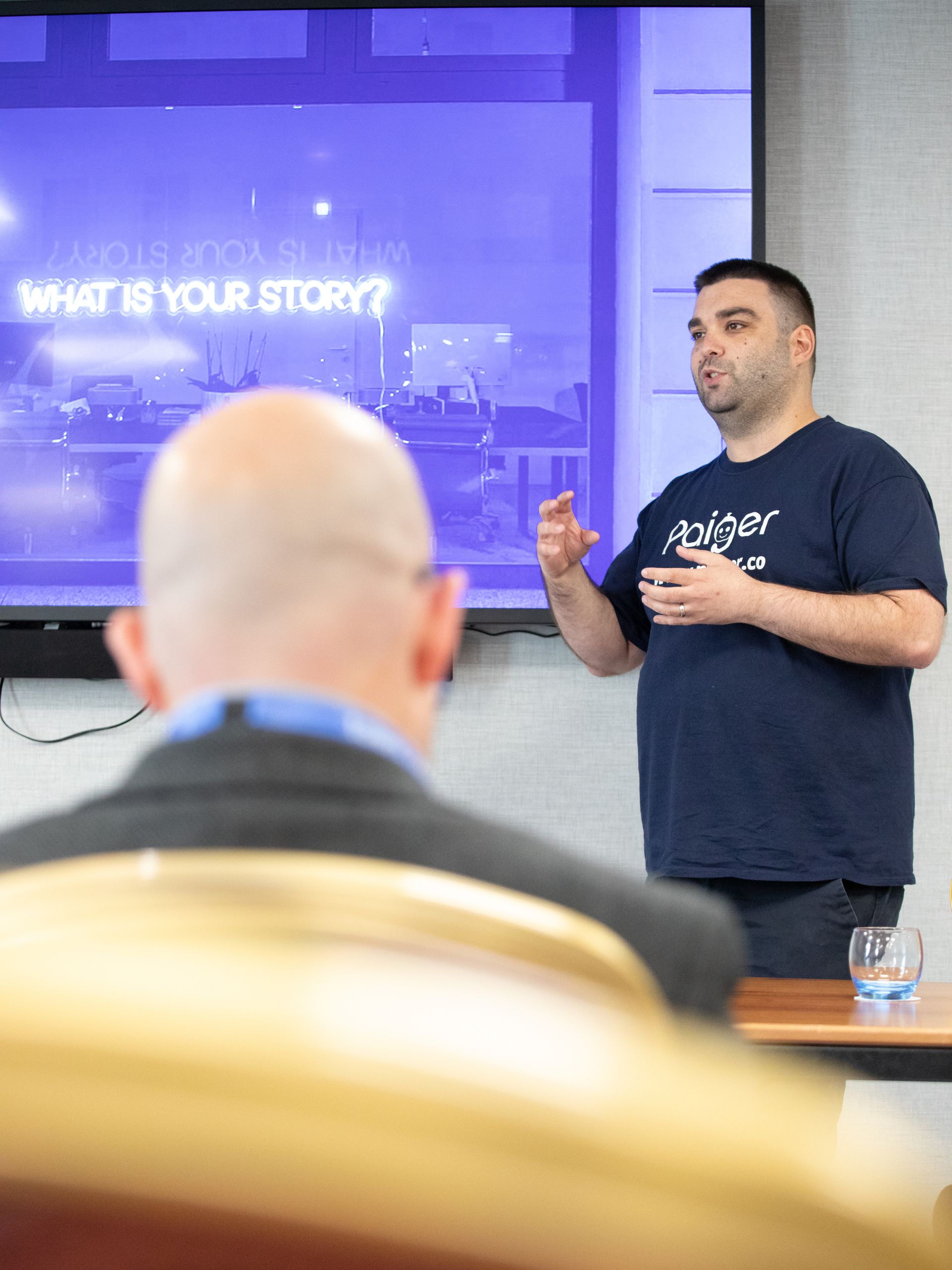 A man is giving a presentation about what is your story