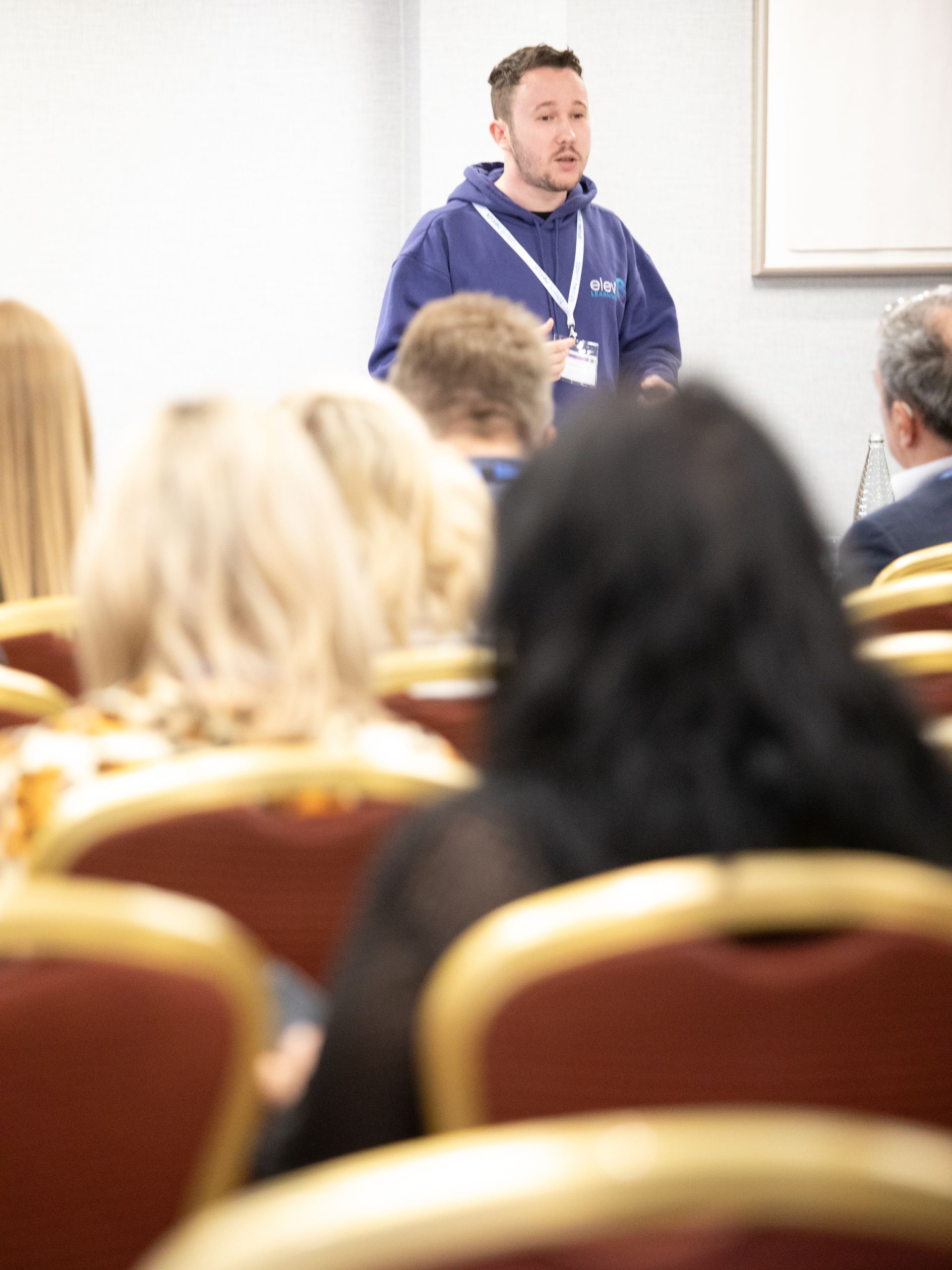 A man is giving a presentation to a group of people