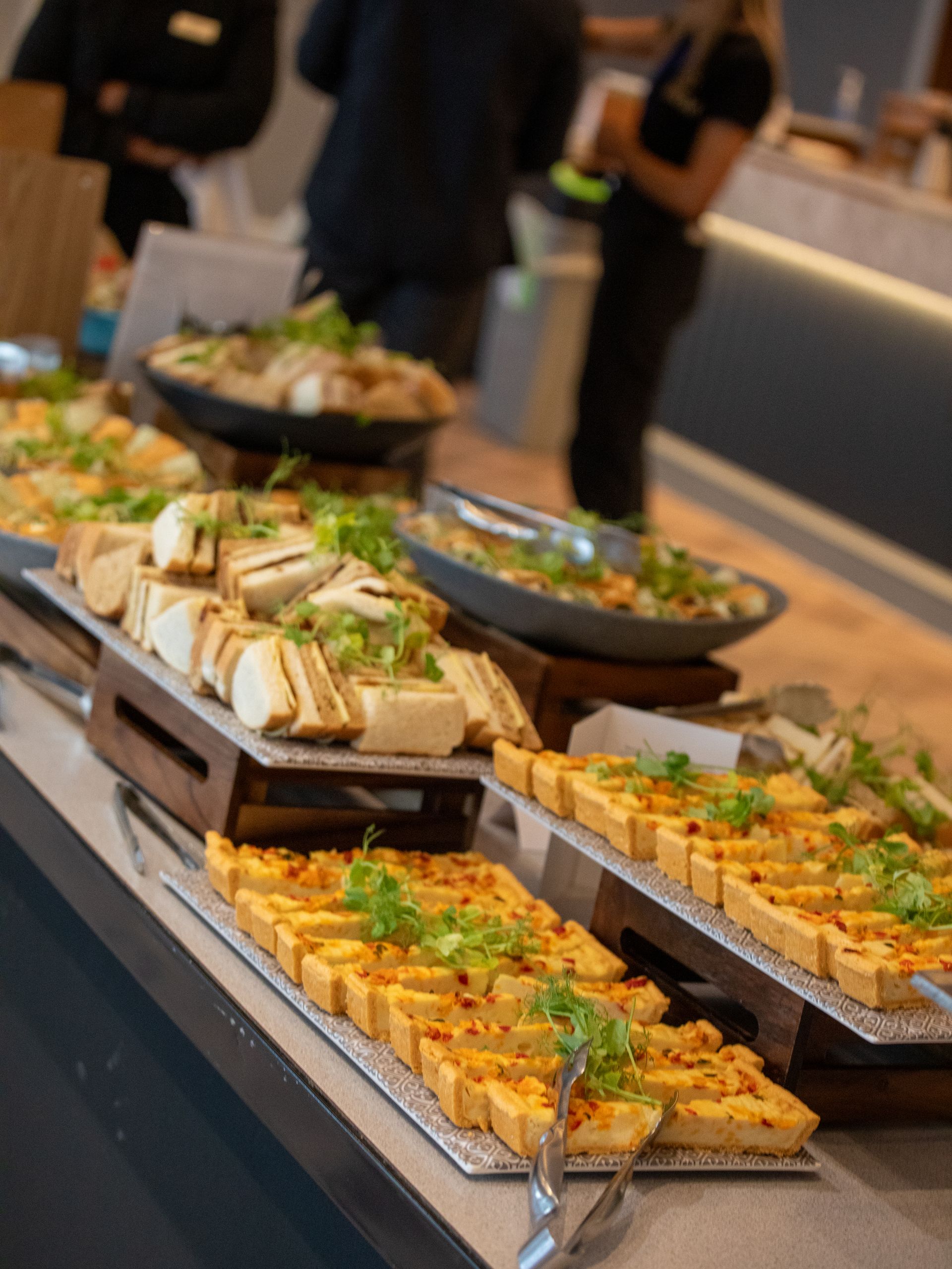 A buffet table with a lot of food on it