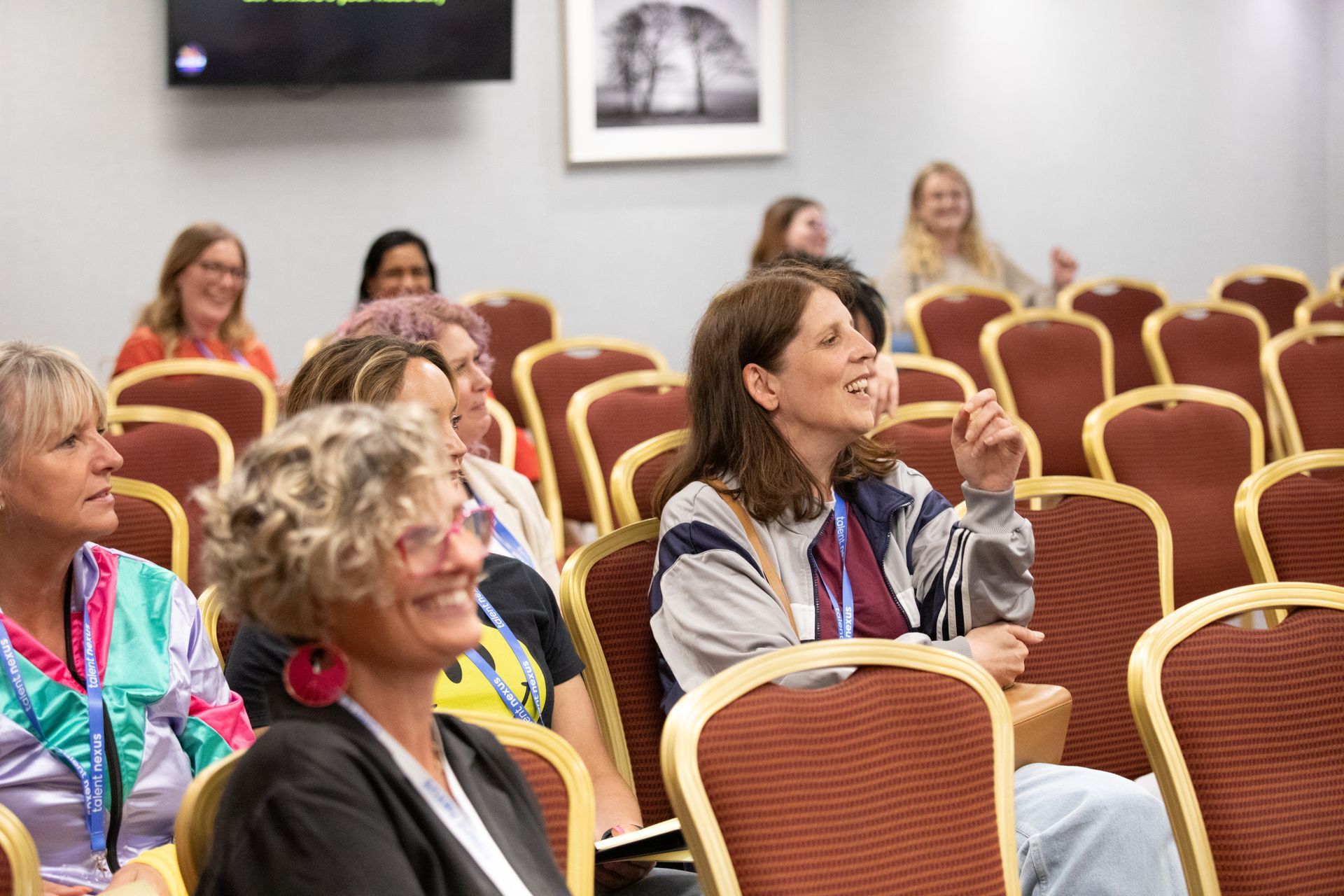 A group of women are sitting in a lecture hall.