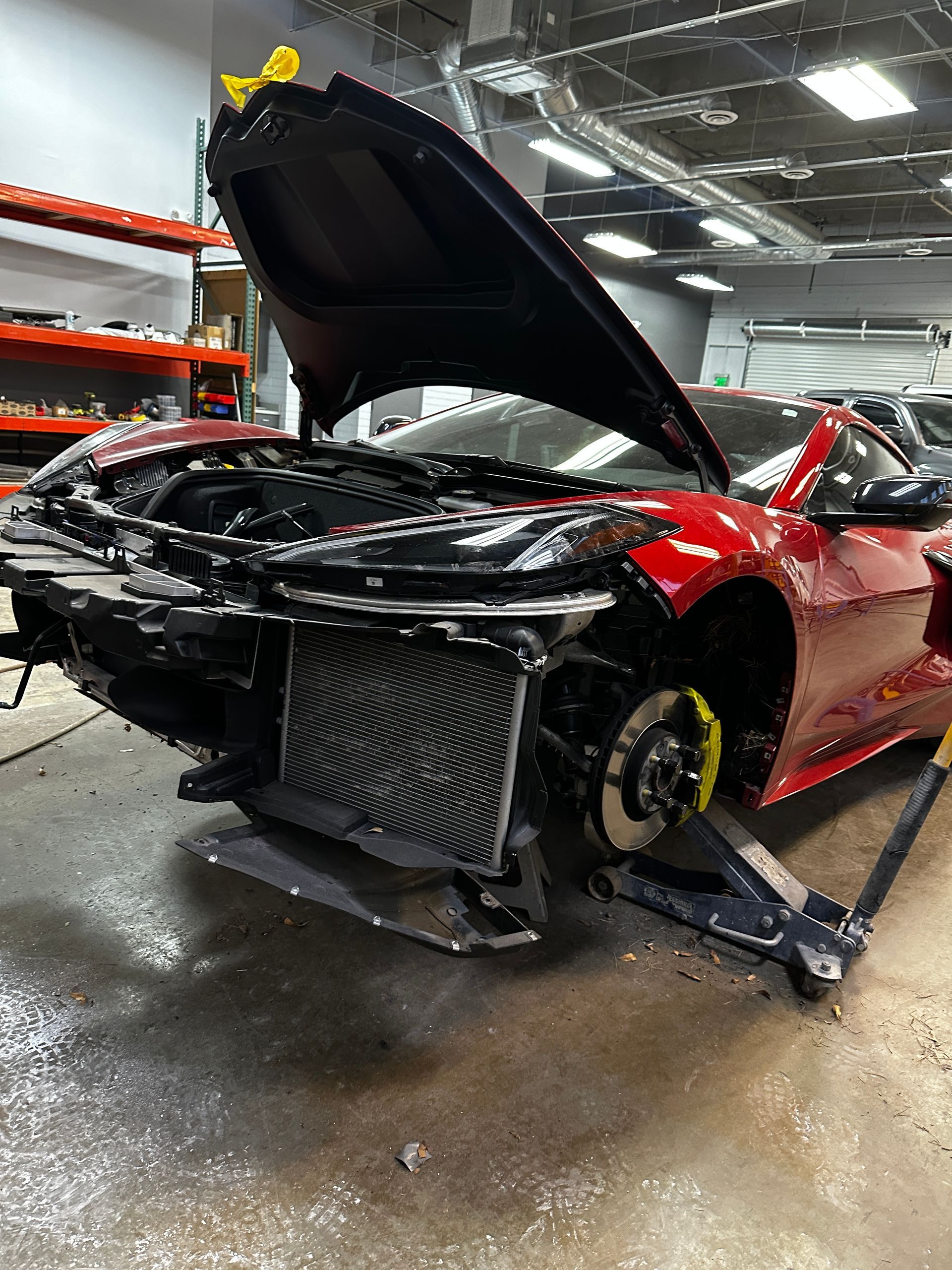 Auto body repair work in progress at collision shop
