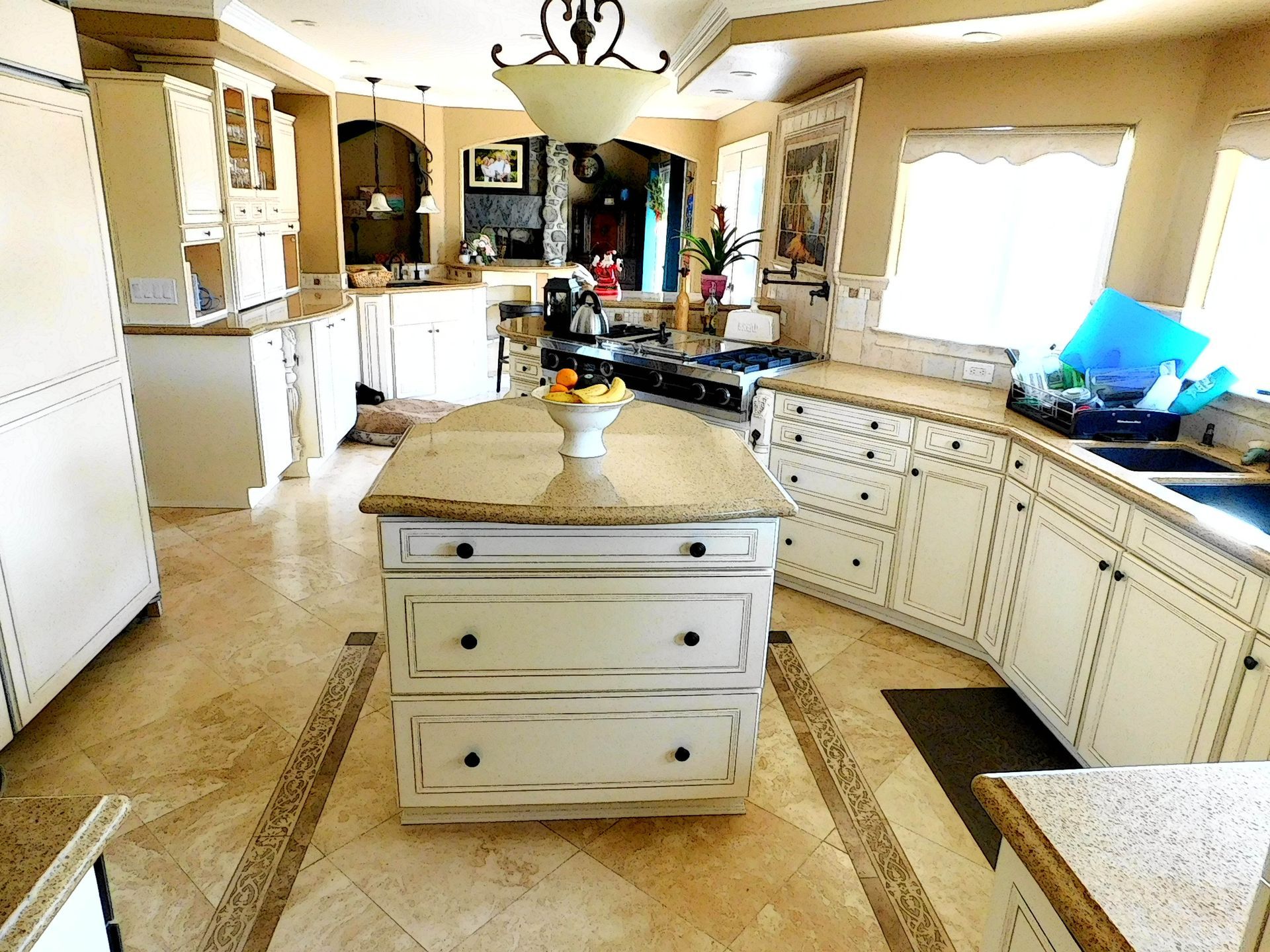A kitchen with a large island in the middle