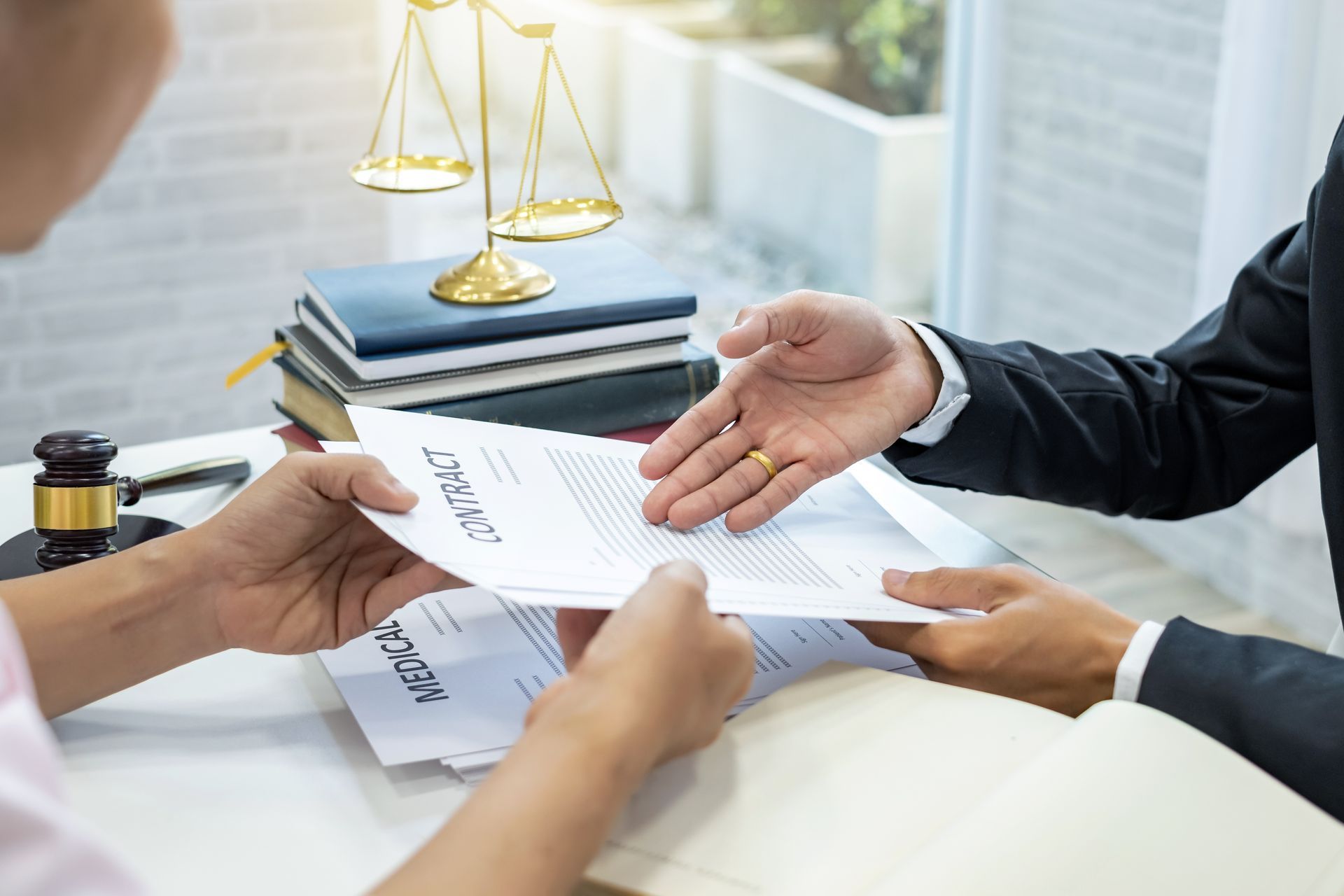 A man is handing a piece of paper to another man.