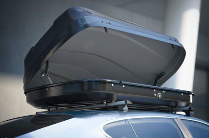 Opened roof rack and modern silver car