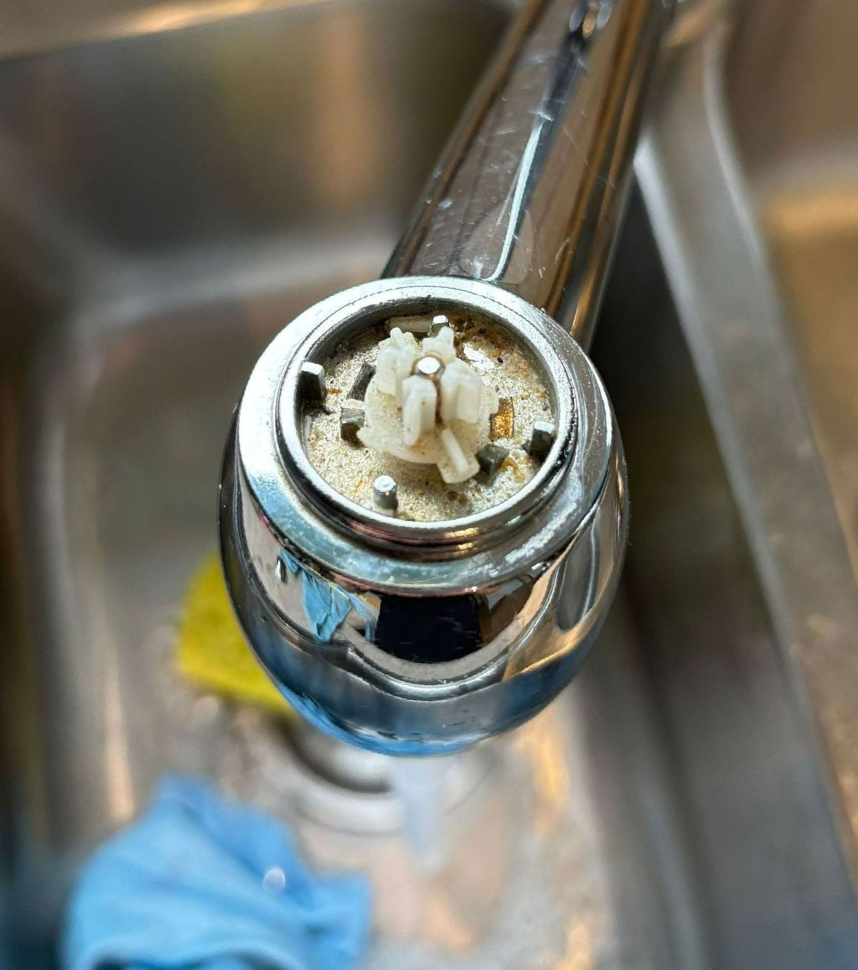 A close up of a faucet in a kitchen sink.