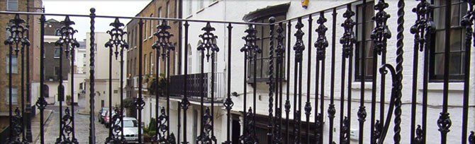 A black wrought iron balcony railing