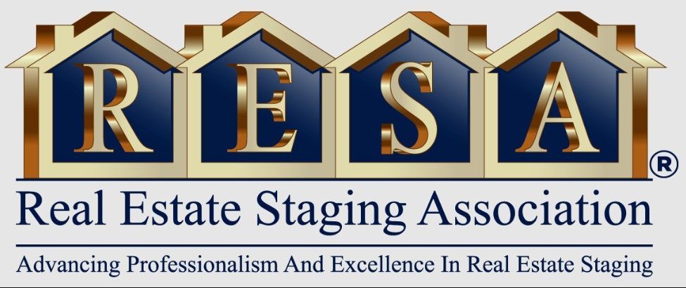 Logo for the Real Estate Staging Association, featuring the acronym RESA in gold letters atop blue house-shaped icons.