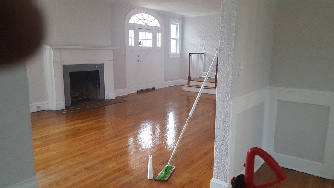 Cleaning wooden floor in living room