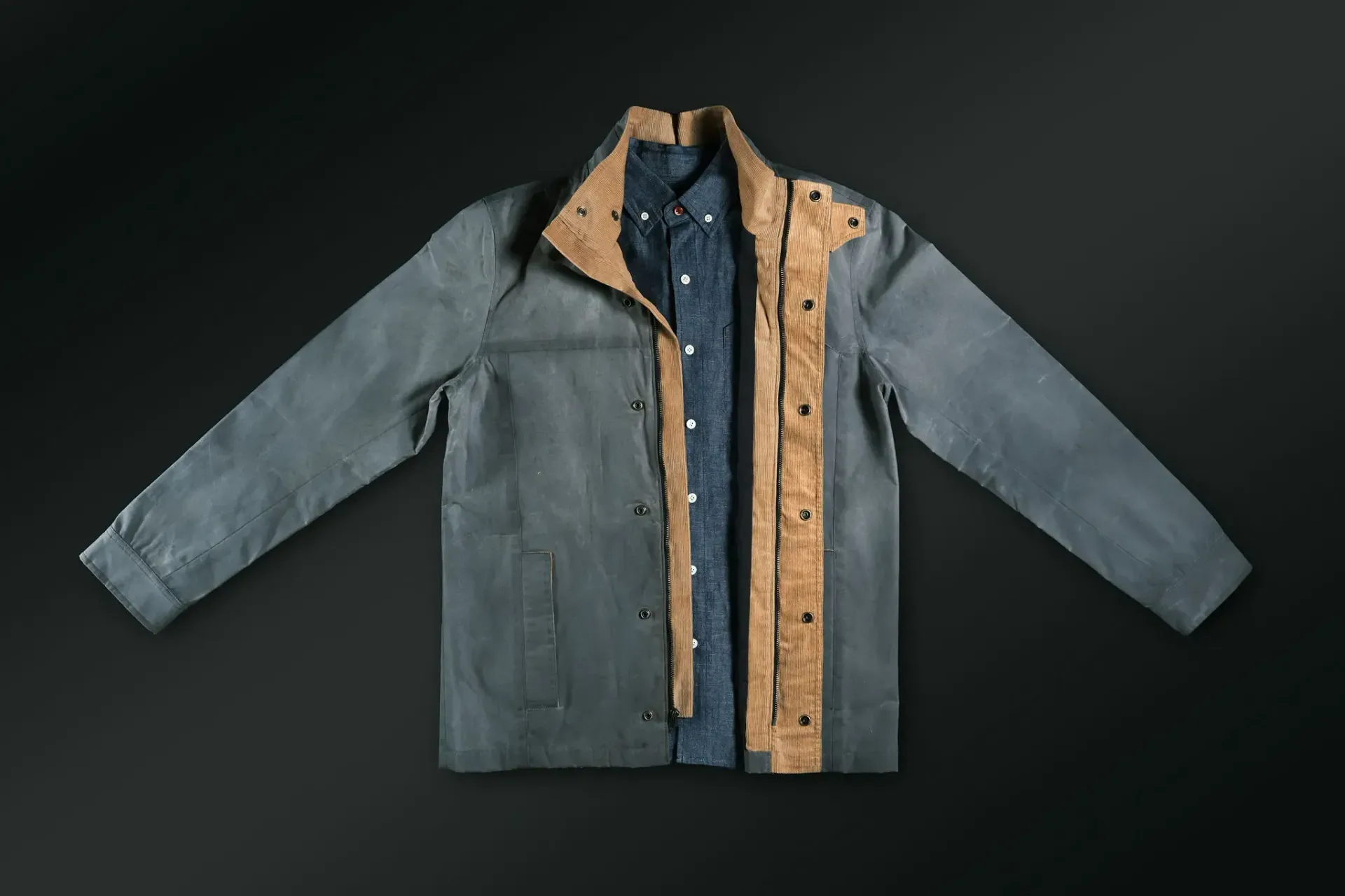 A blue jacket with a denim shirt underneath it