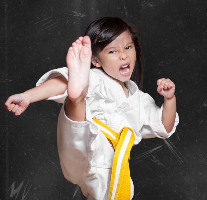 A group of young children are practicing karate together.