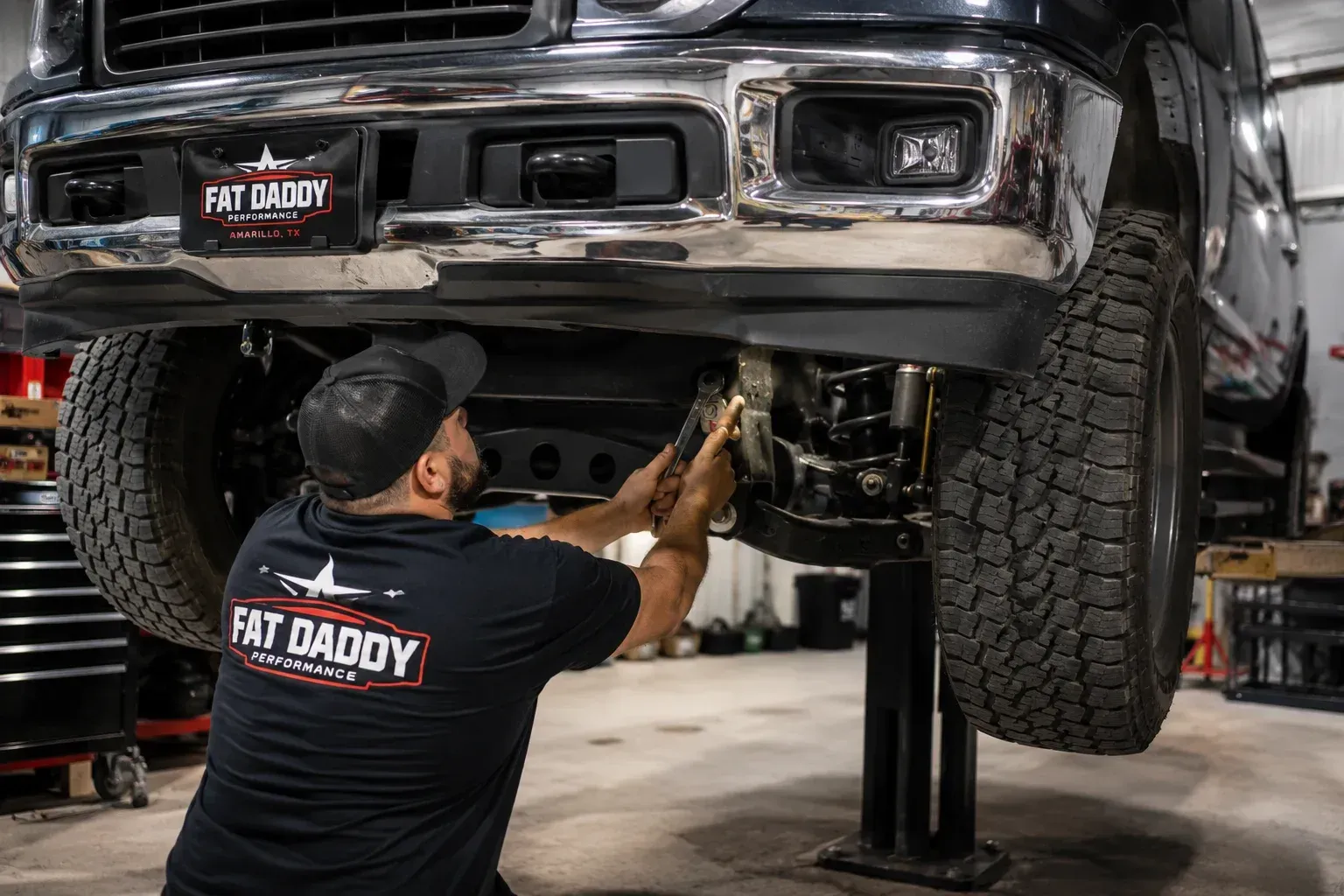 installing a truck leveling kit at Fat Daddy Performance.