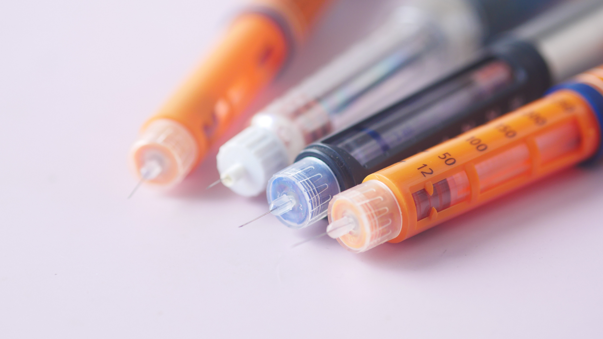 Smiling person in white sports bra and jeans dancing in a bright living room