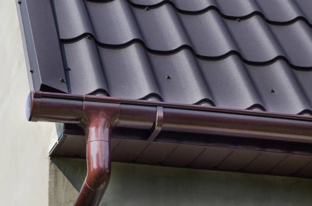 Brown roof with matching gutters and downspout.