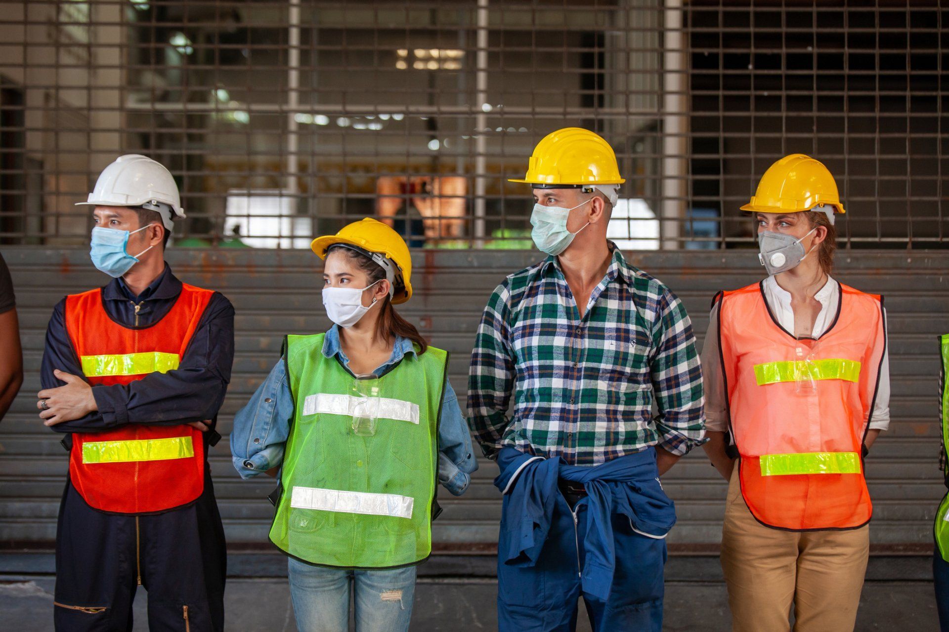 Workers wearing helmet and safety vest