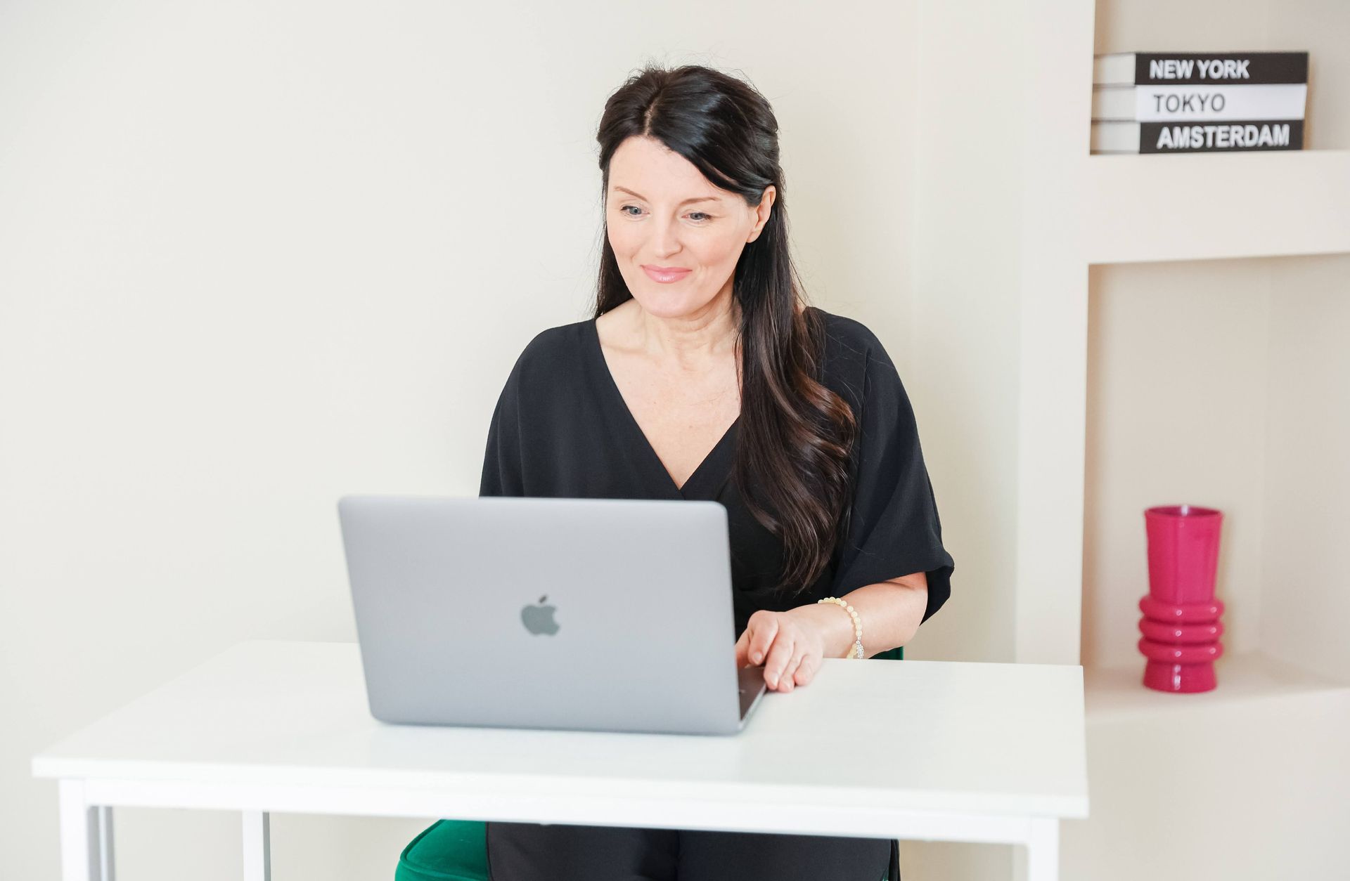 Claire Mullaney Ai Expert at her laptop working