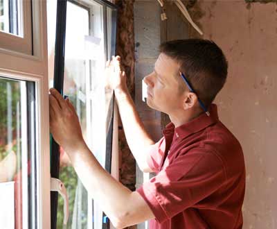 Worker Installing New Window, Door Sales - Baker's Glass & Mirror in Georgetown SC