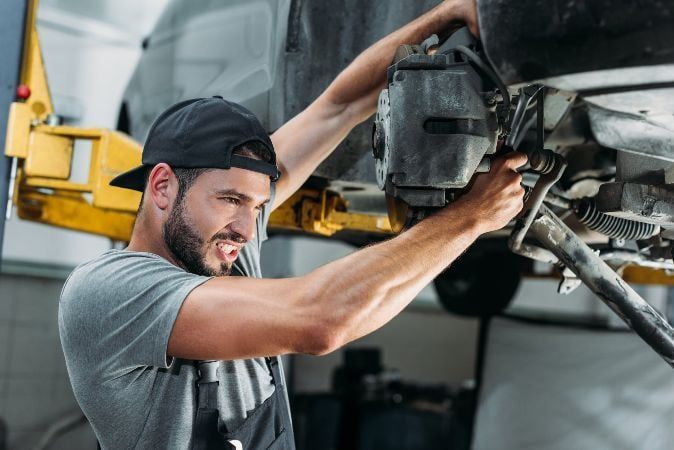 mechanic repairing car mechanic repairing car