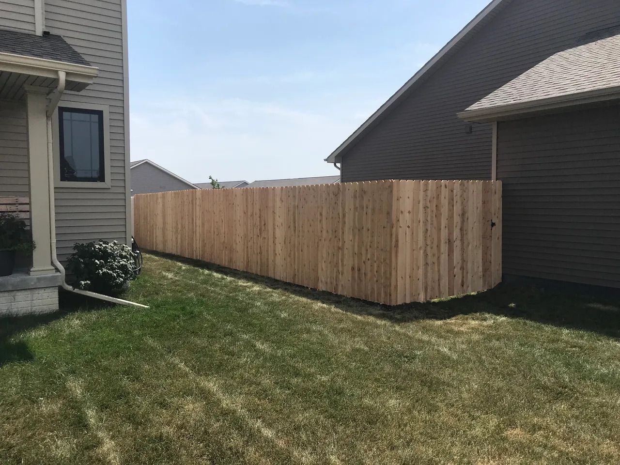 House Backyard with Wooden Fence — Bondurant, IA — Titan Fence LLC