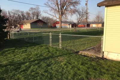 Chain Link Fence in the Backyard of a House — Bondurant, IA — Titan Fence LLC