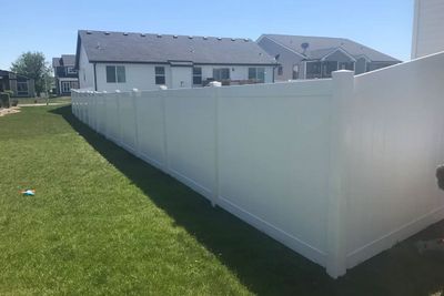 White Fence in the Backyard of a House — Bondurant, IA — Titan Fence LLC