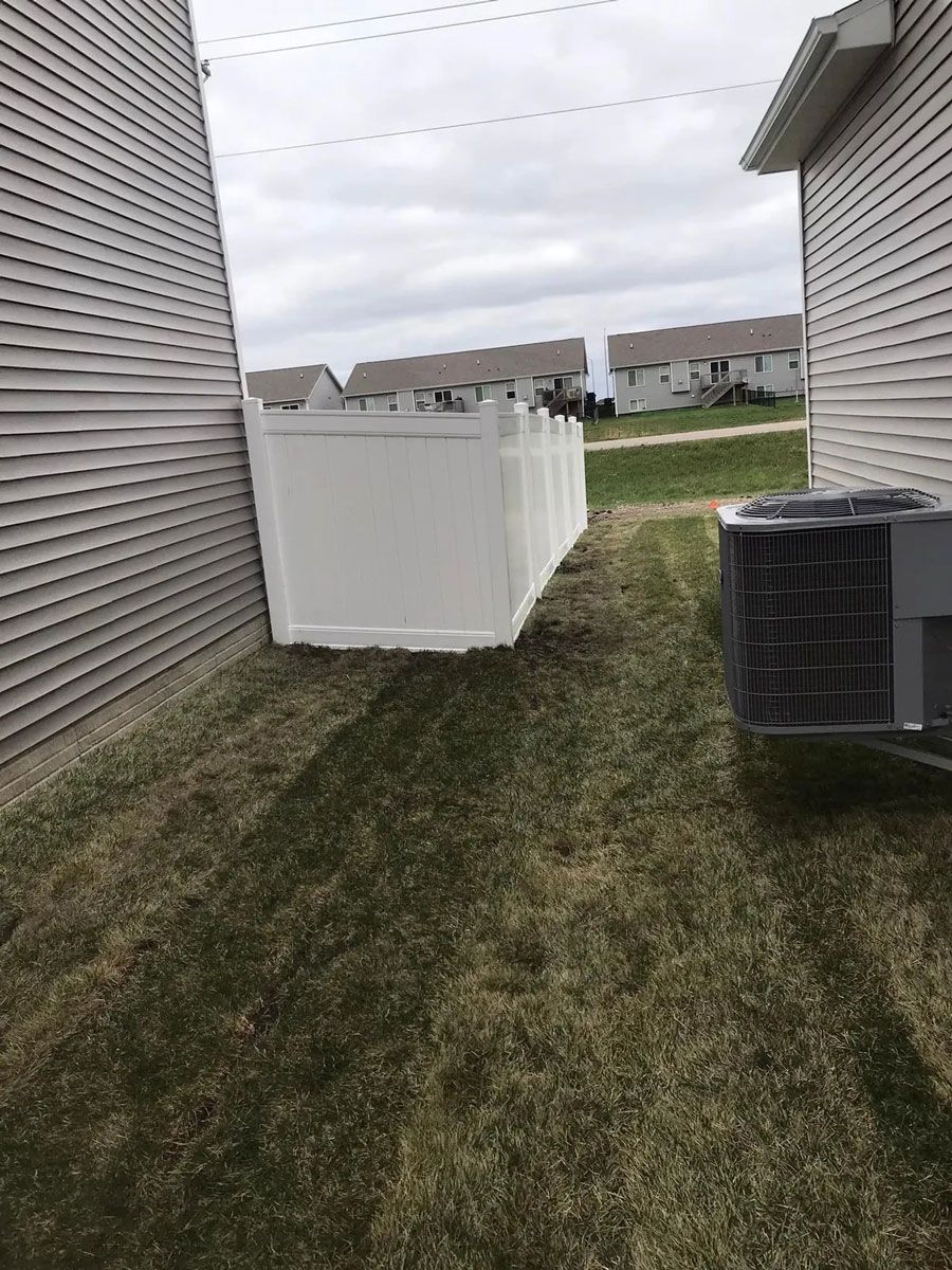 White Fence Next to a House — Bondurant, IA — Titan Fence LLC