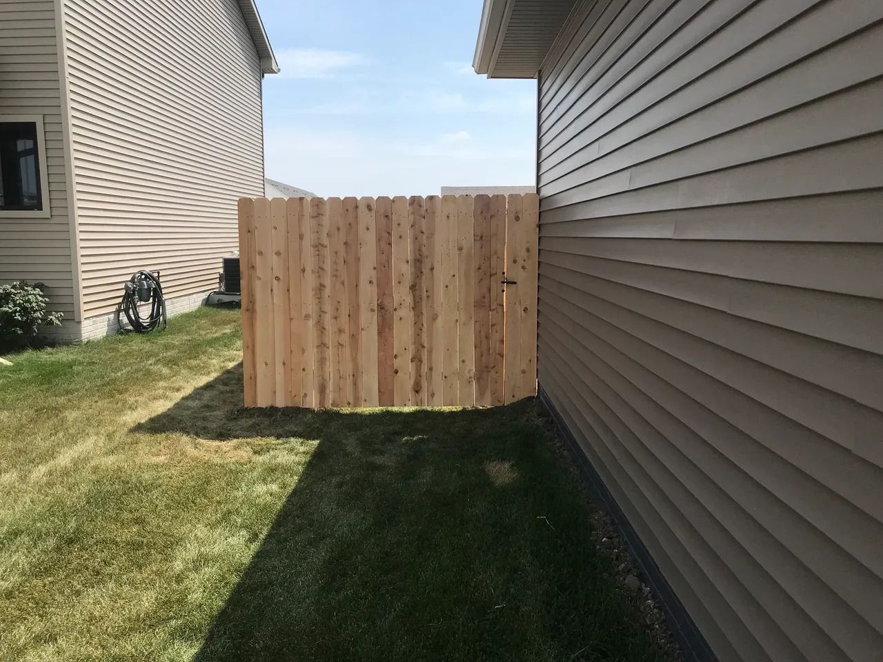 Wooden Fence in the Backyard of a House — Bondurant, IA — Titan Fence LLC