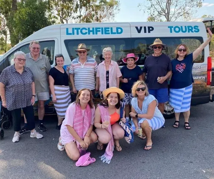 Group Poses in Front of a Van That Says Litchfield Vip Tours — Litchfield VIP Tours In Darwin City, NT