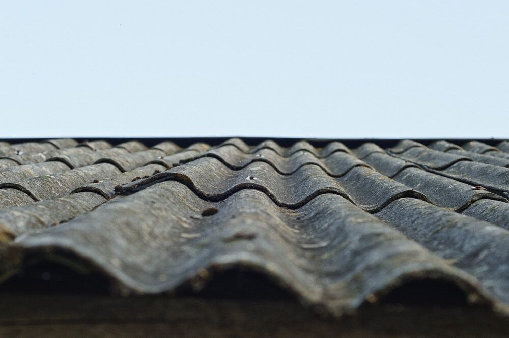 A Close Up Of A Roof With A Blue Sky In The Background — Australian Asbestos Management Pty Ltd In Kunda Park, QLD