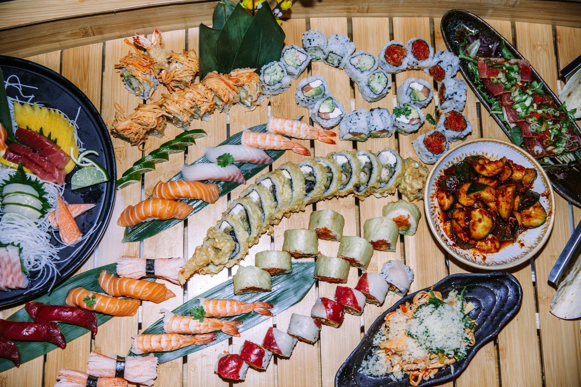 A wooden tray filled with different types of soap.