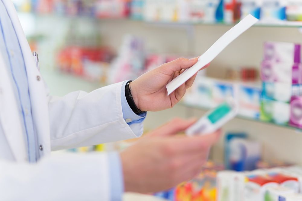 Pharmacist Filling Prescription In Pharmacy — Your Pharmacy in Wulguru, QLD