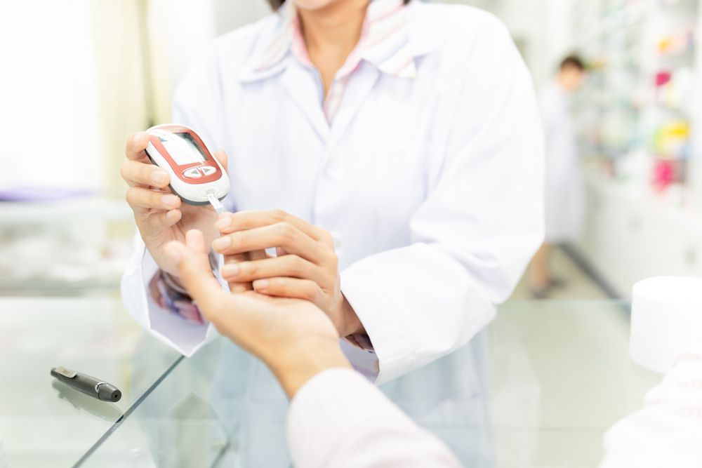 Healthcare Worker Use Glucometer Screening And Diabetic Screening — Diabetes Services in Wulguru, QLD