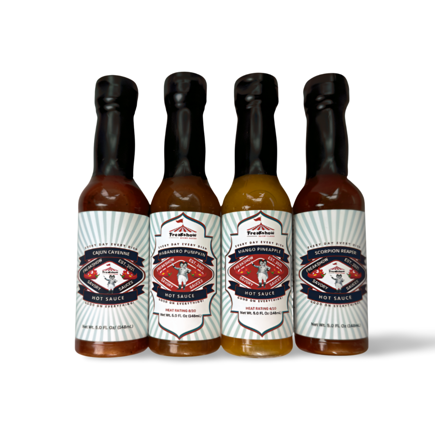 Four bottles of hot sauce are lined up in a row