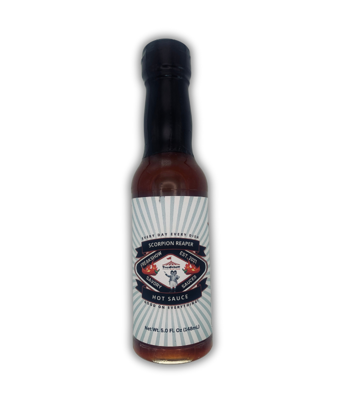 a bottle of freakshow savory sauces scorpion reaper hot sauce with mascot bob clarence on the label .