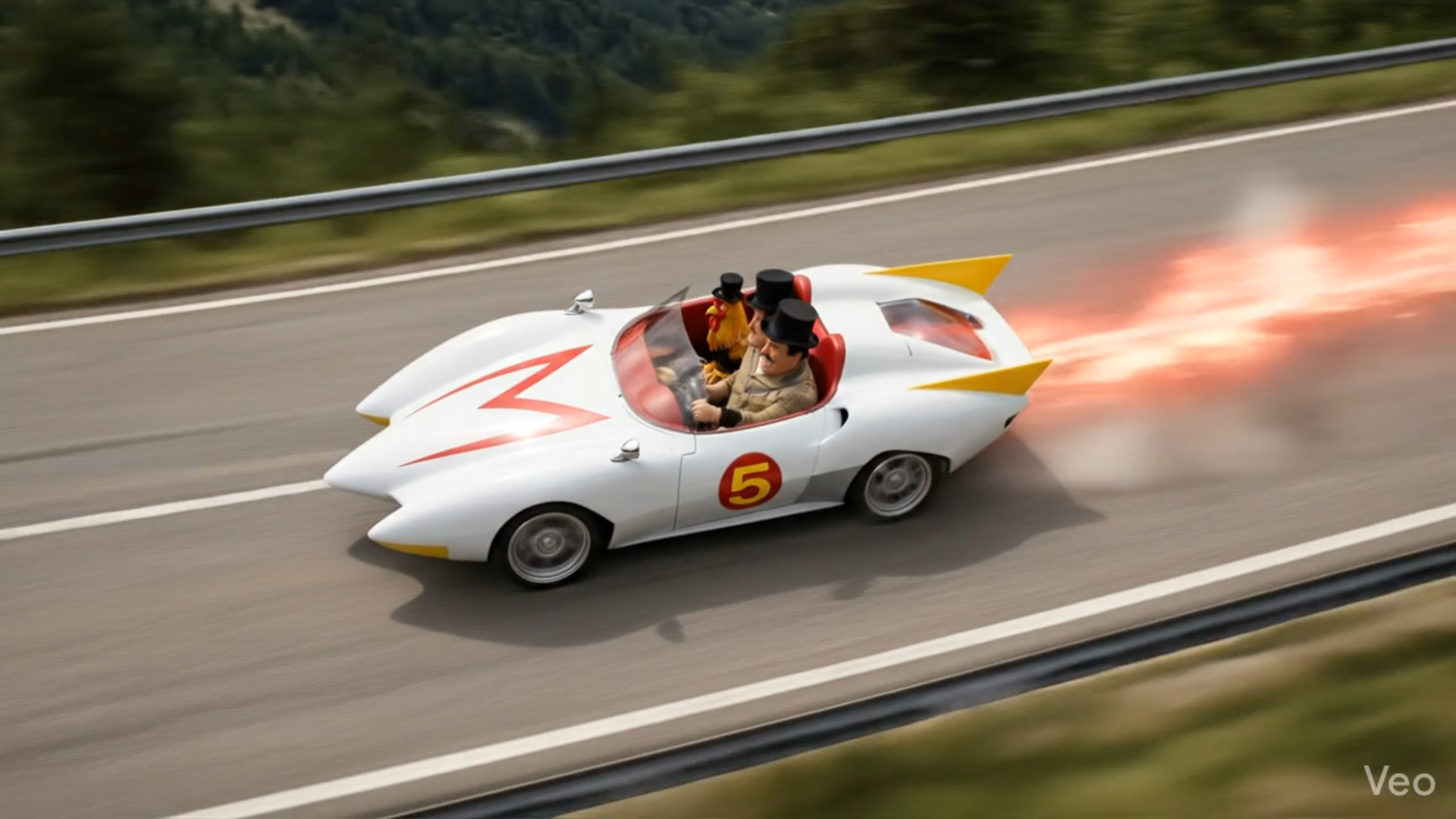 The Mach 5 race car drives on a road with bright flames shooting from its rear, displaying the number 5 and a red M.