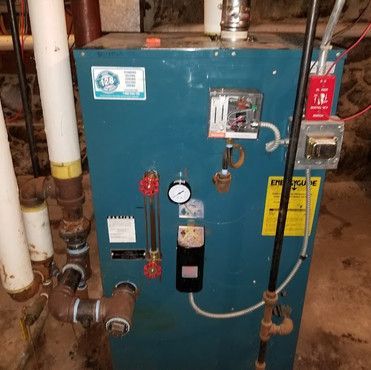 A blue boiler with a sticker on it that says energy