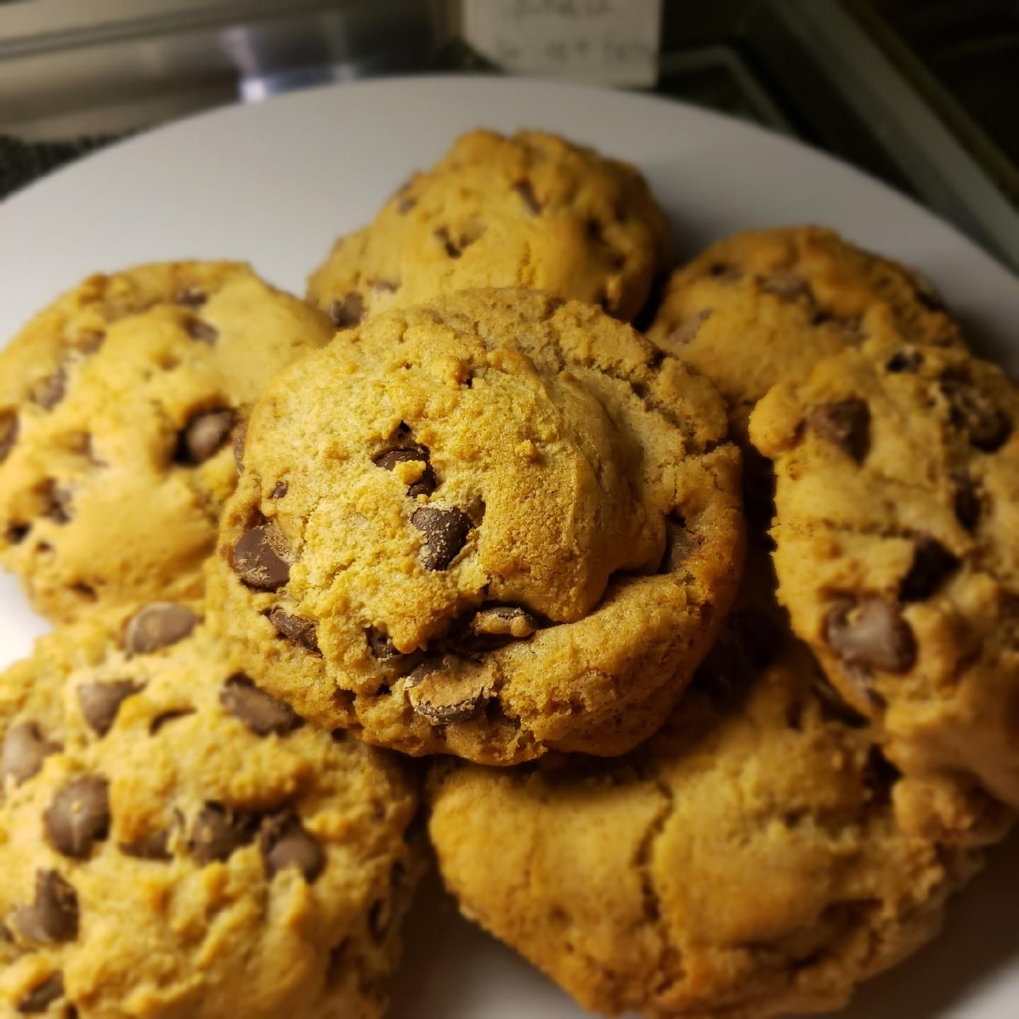 A plate of chocolate chip cookies on a table