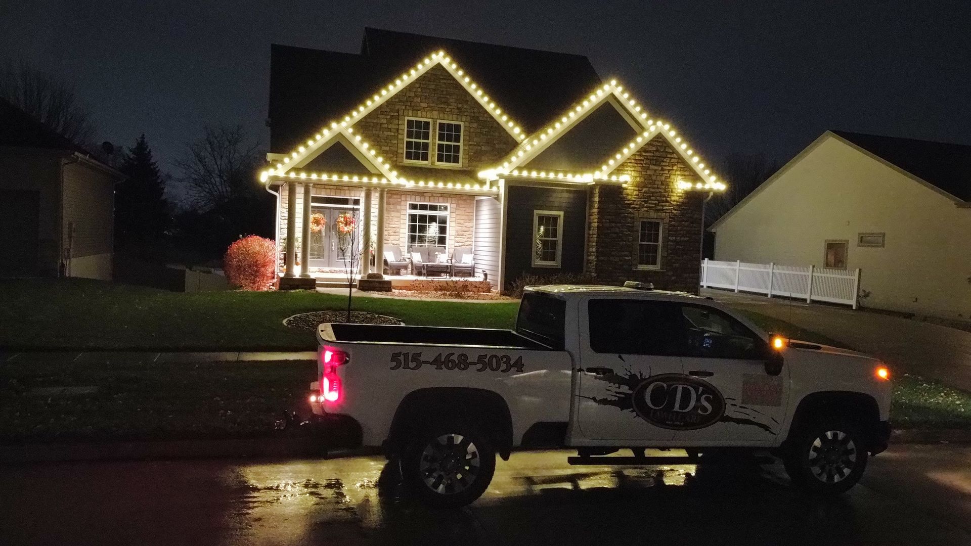 Soft white C9 holiday lights installed on a Central Iowa home by CD’s Lawn Care