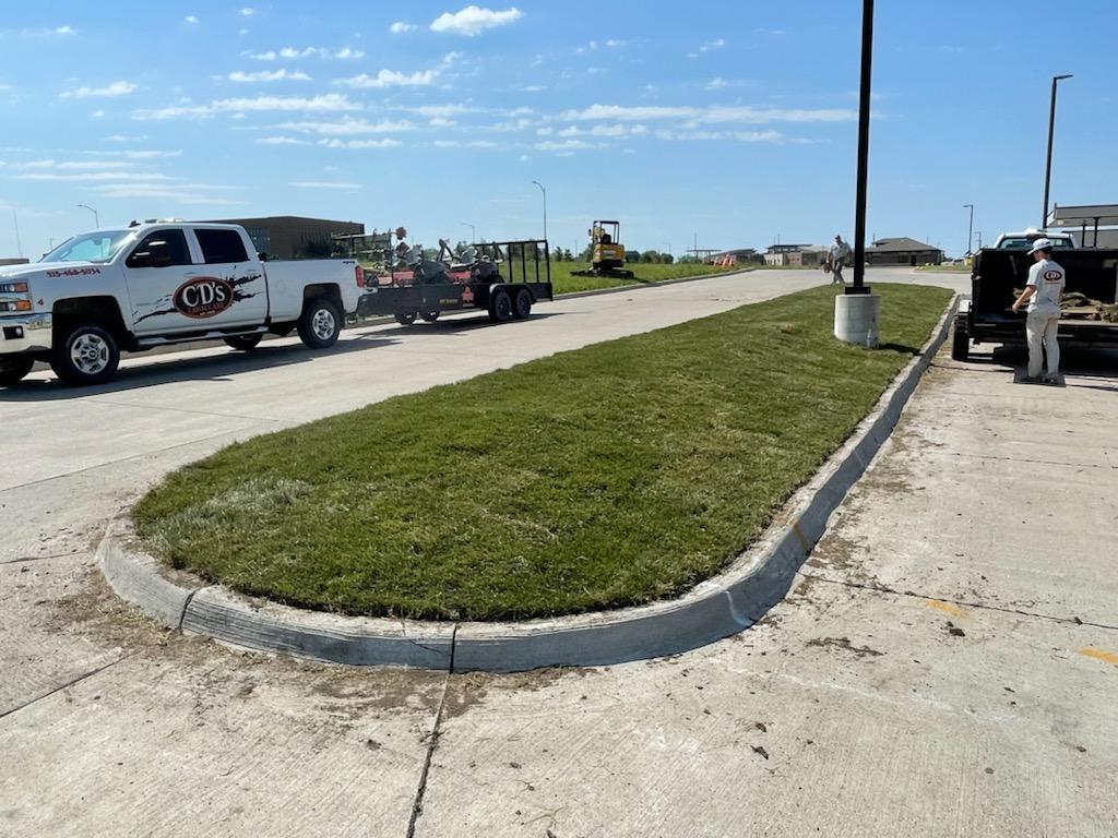 Grading and sod installation at a Central Iowa commercial landscape project