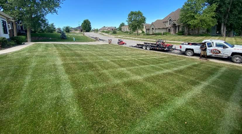 Professional mowing stripes on a commercial lawn maintained by CD’s Lawn Care