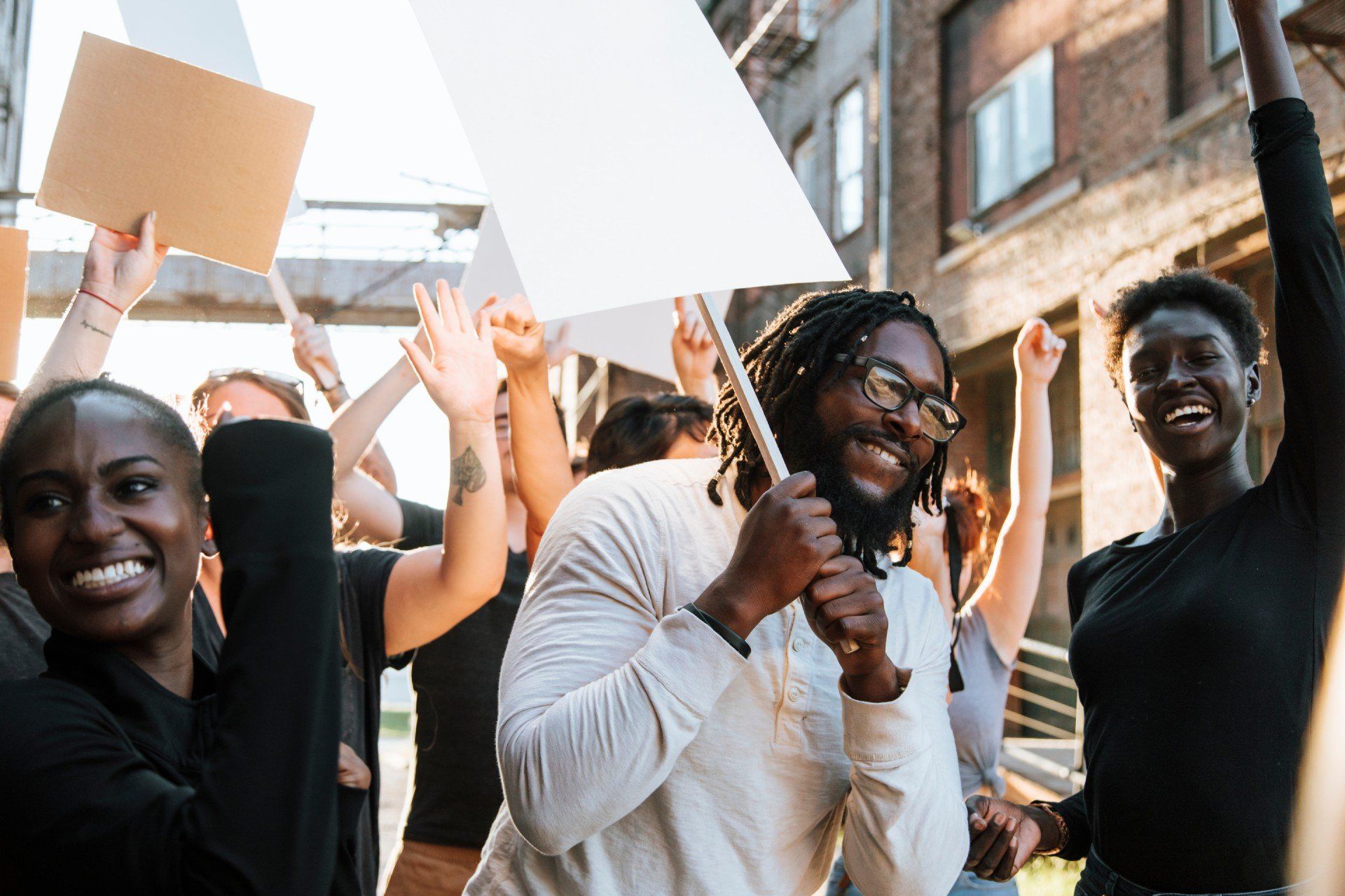 arms raised in protest