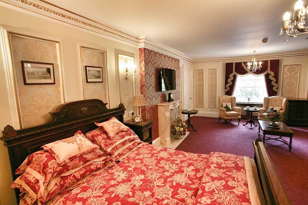Elegant resident bedroom at Nunthorpe Hall with traditional furnishings and en-suite comfort